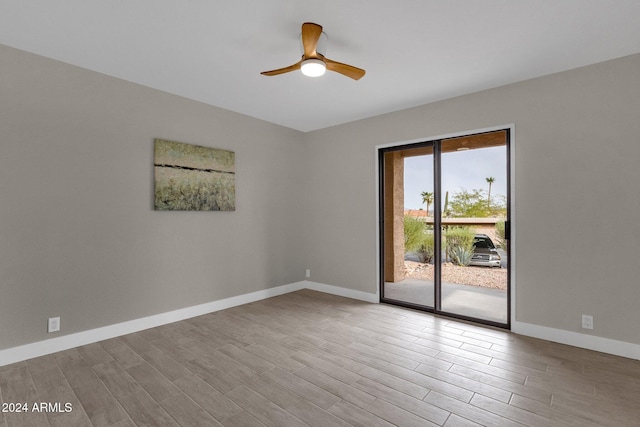 spare room with ceiling fan and light hardwood / wood-style floors