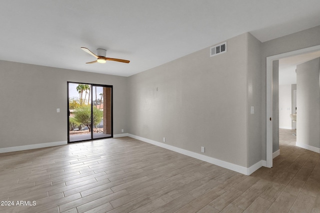 unfurnished room with ceiling fan and light wood-type flooring