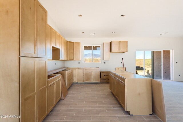 kitchen featuring light brown cabinets