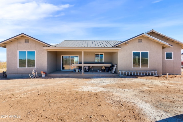 rear view of house with a patio area