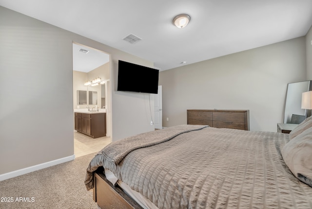 38150 W San Sisto Ave, Maricopa, AZ 85138 - bedroom with light carpet, baseboards, and ensuite bathroom