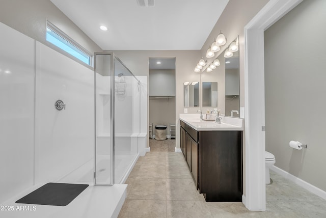 38150 W San Sisto Ave, Maricopa, AZ 85138 - full bathroom with a stall shower, toilet, vanity, and baseboards