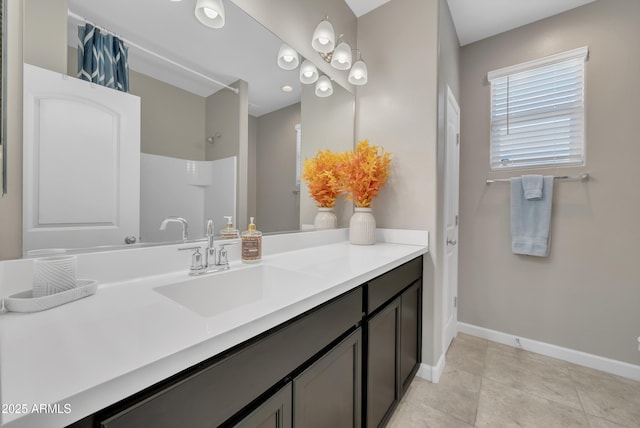 38150 W San Sisto Ave, Maricopa, AZ 85138 - full bath featuring baseboards, a shower, vanity, and tile patterned floors
