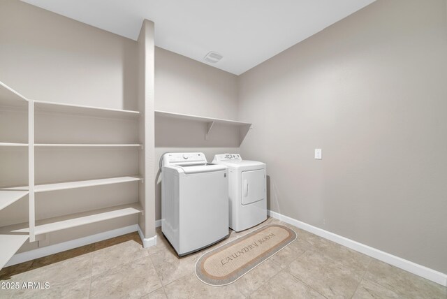 38150 W San Sisto Ave, Maricopa, AZ 85138 - laundry area with washer and clothes dryer and baseboards