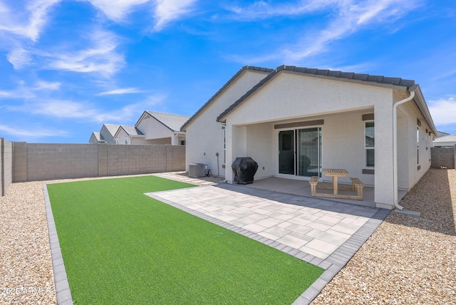 38150 W San Sisto Ave, Maricopa, AZ 85138 - back of property with stucco siding, a fenced backyard, and a patio area