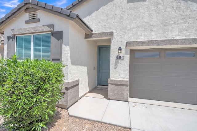 38150 W San Sisto Ave, Maricopa, AZ 85138 - doorway to property with stucco siding
