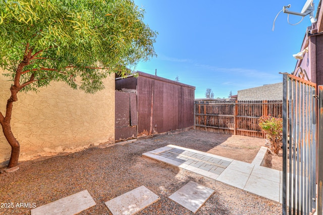 view of yard featuring a patio area and a fenced backyard