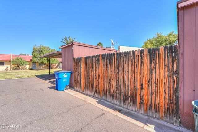 exterior space with fence and a yard