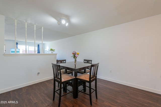 dining room with wood finished floors and baseboards