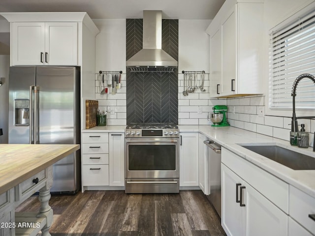 5110 E Peak View Rd, Cave Creek, AZ 85331 - kitchen featuring a sink, wall chimney exhaust hood, dark wood finished floors, butcher block counters, and stainless steel appliances