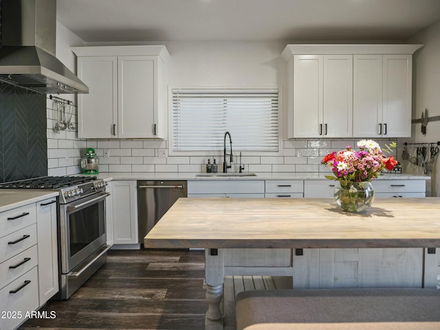 5110 E Peak View Rd, Cave Creek, AZ 85331 - kitchen with wooden counters, wall chimney exhaust hood, a sink, and stainless steel appliances