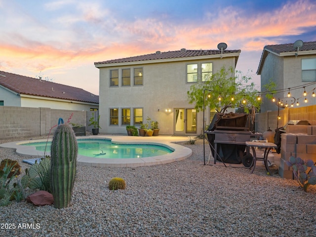 5110 E Peak View Rd, Cave Creek, AZ 85331 - pool at dusk featuring a fenced backyard, a patio, and a fenced in pool
