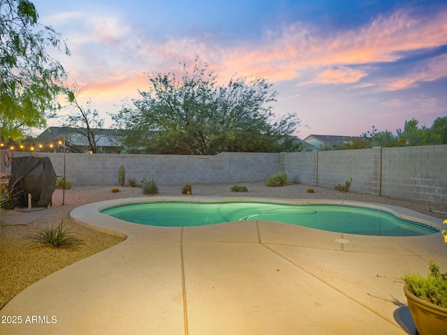 5110 E Peak View Rd, Cave Creek, AZ 85331 - pool at dusk featuring a fenced backyard, a patio, and a fenced in pool