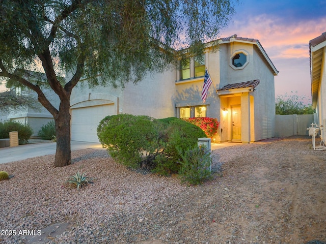 5110 E Peak View Rd, Cave Creek, AZ 85331 - view of front of house with fence, an attached garage, concrete driveway, a tile roof, and stucco siding