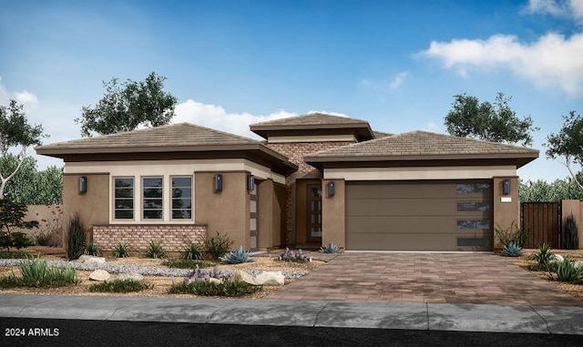 prairie-style home featuring a garage