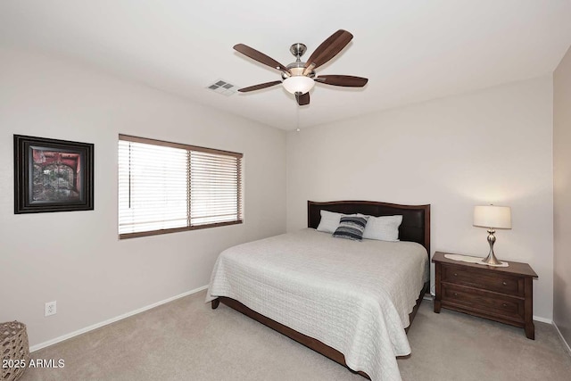 bedroom with ceiling fan and light colored carpet