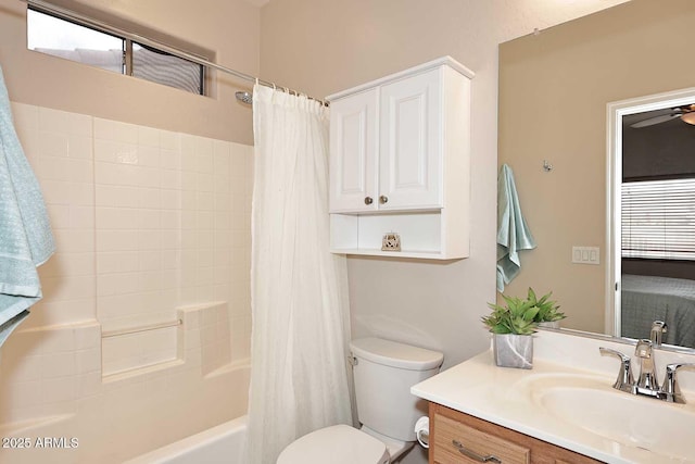 full bathroom with shower / tub combo with curtain, vanity, and toilet