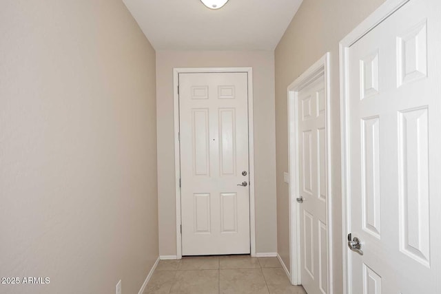 doorway featuring light tile patterned floors