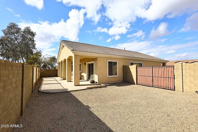 back of property with a patio area