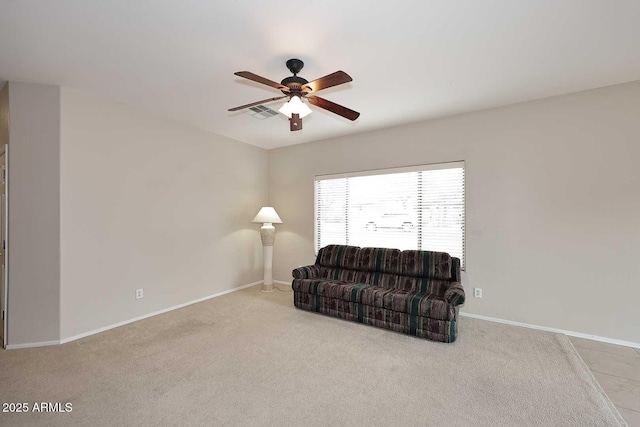 sitting room featuring ceiling fan and light carpet