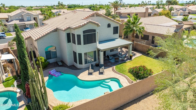 1694 E Campbell Ave, Gilbert, AZ 85234 - back of property with stucco siding, a fenced backyard, a residential view, a patio, and a tile roof