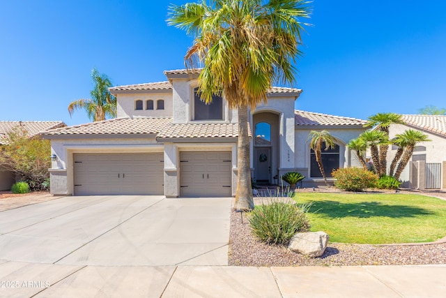 1694 E Campbell Ave, Gilbert, AZ 85234 - mediterranean / spanish-style house featuring stucco siding, concrete driveway, a tiled roof, a front yard, and a garage