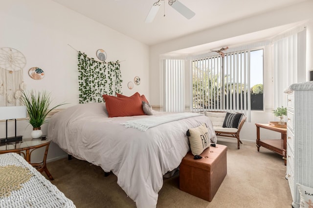 bedroom featuring light colored carpet and a ceiling fan