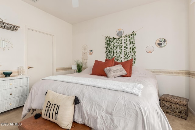 carpeted bedroom featuring a ceiling fan