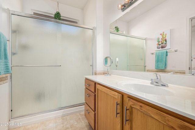 bathroom with vanity, a stall shower, and tile patterned flooring