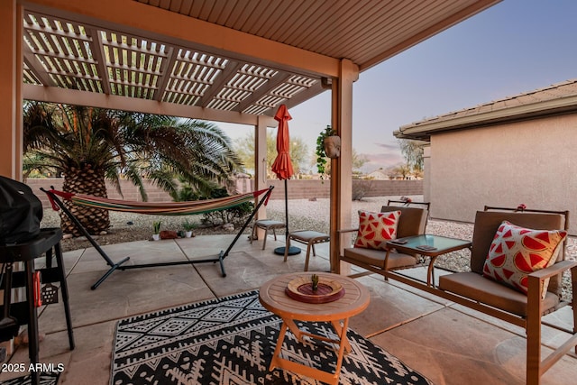 view of patio / terrace featuring a pergola and fence