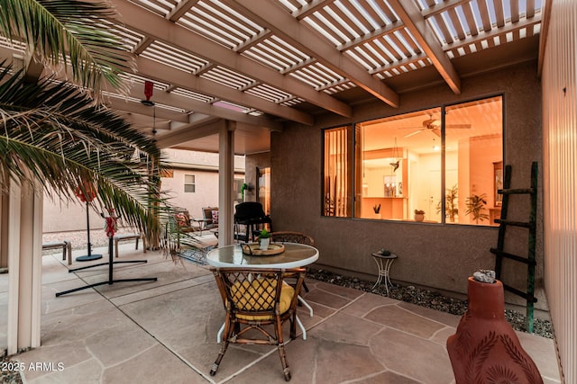 view of patio featuring outdoor dining space and a pergola