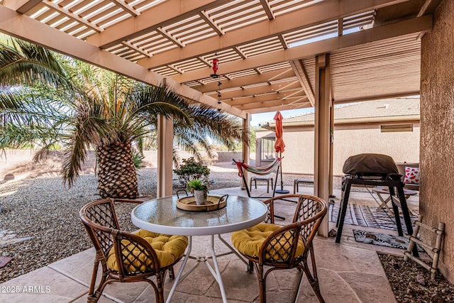 view of patio featuring outdoor dining space, a pergola, and fence