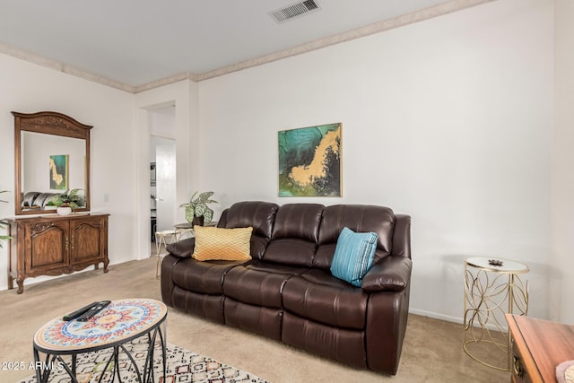 living room with baseboards, light colored carpet, visible vents, and ornamental molding