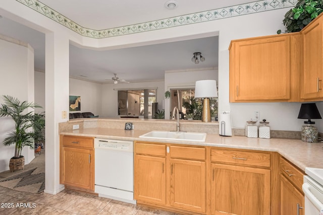 kitchen with a ceiling fan, a peninsula, a sink, light countertops, and dishwasher