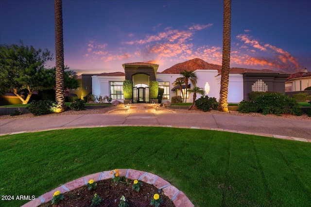 view of front of home with a lawn