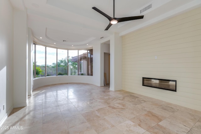 unfurnished living room with recessed lighting, a large fireplace, visible vents, and ceiling fan