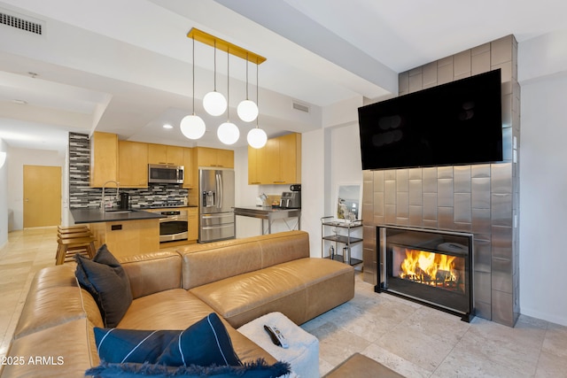 7131 E Rancho Vista Dr Unit 1008, Scottsdale, AZ 85251 - living area with a large fireplace and baseboards