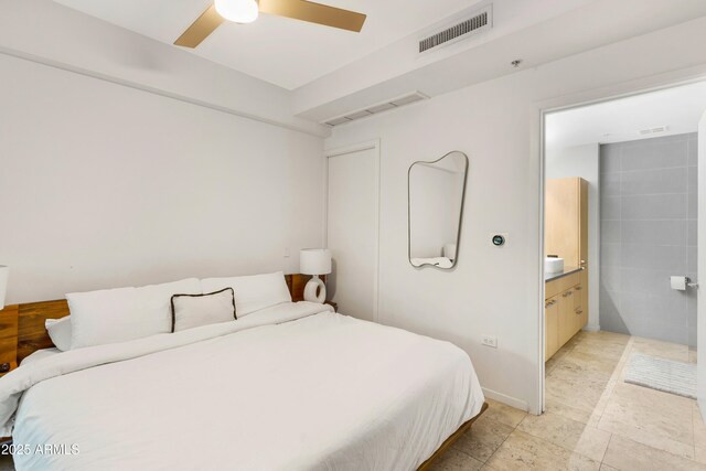 7131 E Rancho Vista Dr Unit 1008, Scottsdale, AZ 85251 - bedroom featuring a ceiling fan and ensuite bathroom