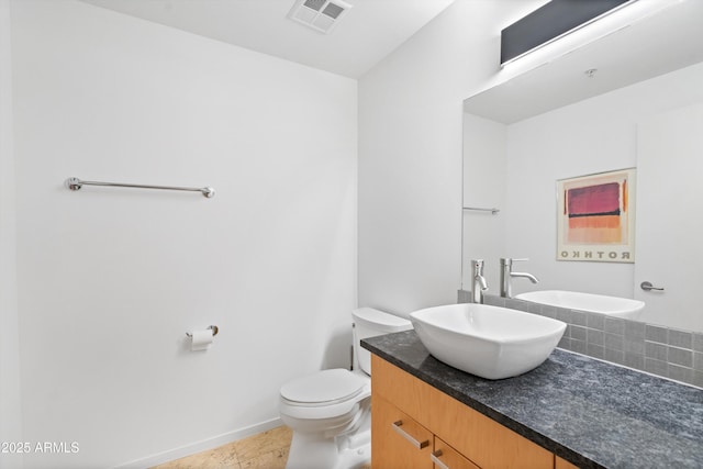 7131 E Rancho Vista Dr Unit 1008, Scottsdale, AZ 85251 - bathroom featuring toilet, vanity, and baseboards