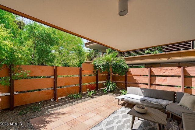 7131 E Rancho Vista Dr Unit 1008, Scottsdale, AZ 85251 - view of patio / terrace with an outdoor hangout area and fence