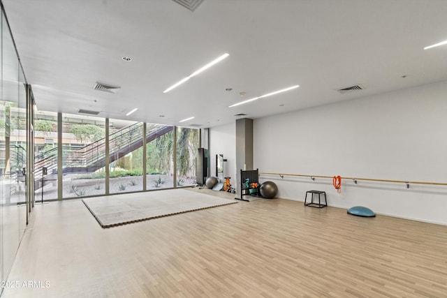 7131 E Rancho Vista Dr Unit 1008, Scottsdale, AZ 85251 - exercise room with floor to ceiling windows and wood finished floors