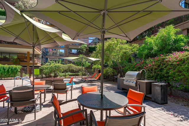 7131 E Rancho Vista Dr Unit 1008, Scottsdale, AZ 85251 - view of patio / terrace featuring a grill and outdoor dining area