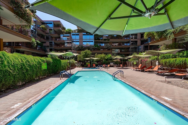 7131 E Rancho Vista Dr Unit 1008, Scottsdale, AZ 85251 - community pool with a patio and fence