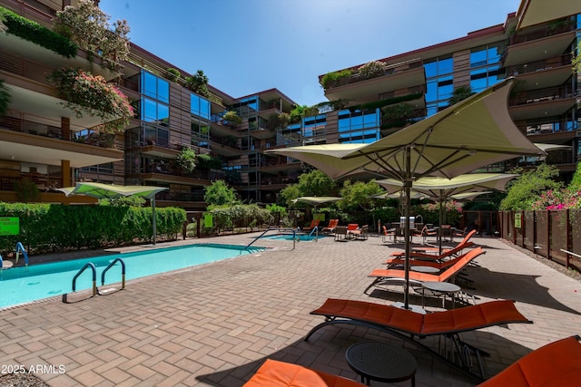 7131 E Rancho Vista Dr Unit 1008, Scottsdale, AZ 85251 - community pool with fence and a patio