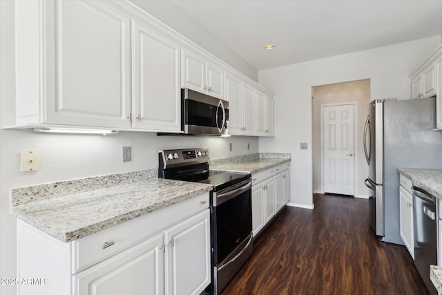 kitchen with stainless steel appliances, dark hardwood / wood-style floors, white cabinets, and light stone counters