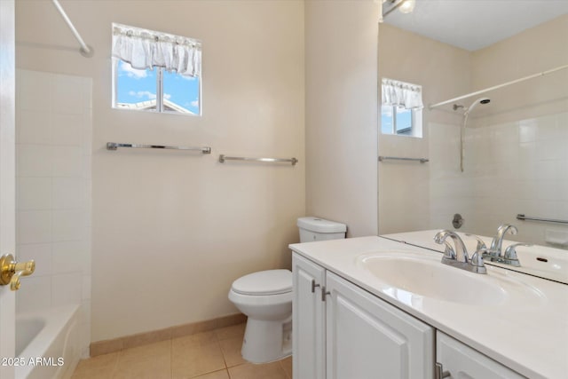 full bathroom featuring tiled shower / bath, tile patterned floors, toilet, and vanity