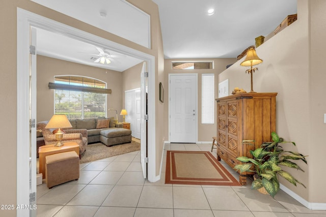 4240 E Strawberry Dr, Gilbert, AZ 85298 - foyer with baseboards, a ceiling fan, and light tile patterned flooring