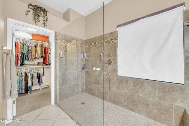 4240 E Strawberry Dr, Gilbert, AZ 85298 - bathroom featuring a walk in closet, tiled shower, and tile patterned flooring