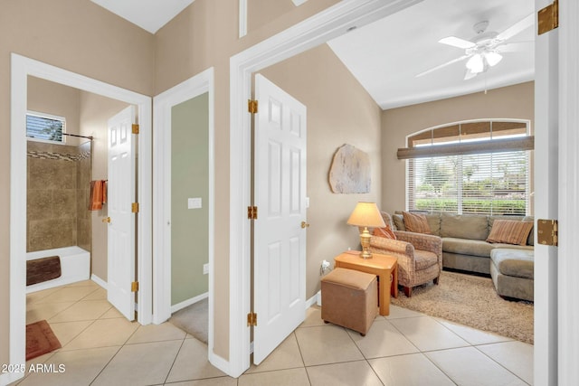 4240 E Strawberry Dr, Gilbert, AZ 85298 - living room with light tile patterned floors, baseboards, and a ceiling fan