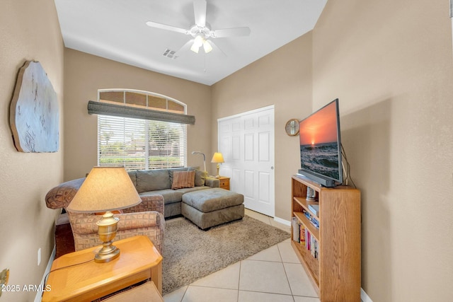 4240 E Strawberry Dr, Gilbert, AZ 85298 - living area with baseboards, light tile patterned flooring, ceiling fan, and visible vents